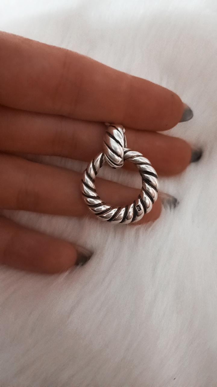 Dije argolla de plata inflada